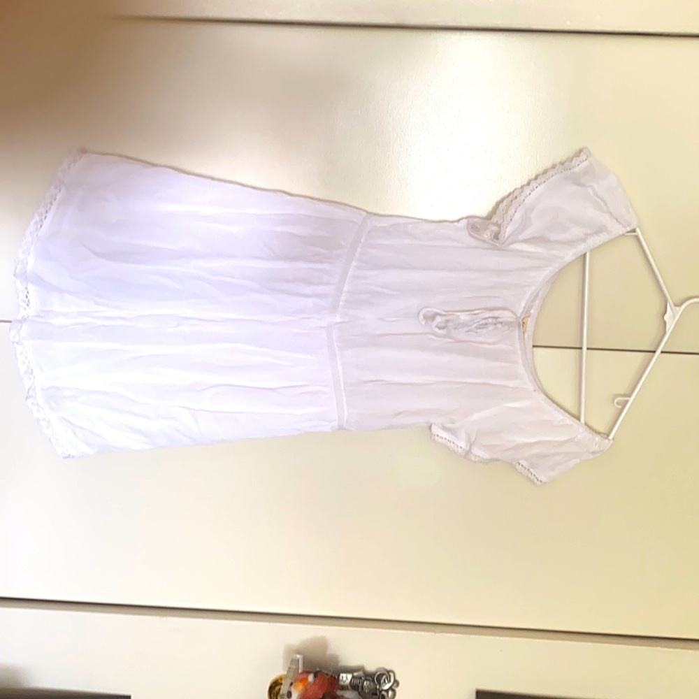 It’s a white off the shoulder dress.